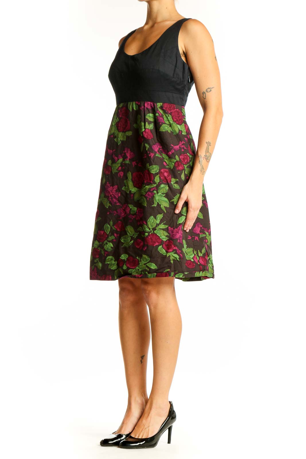 Front view of Moulinette Soeurs black dress with floral print skirt and empire waist
