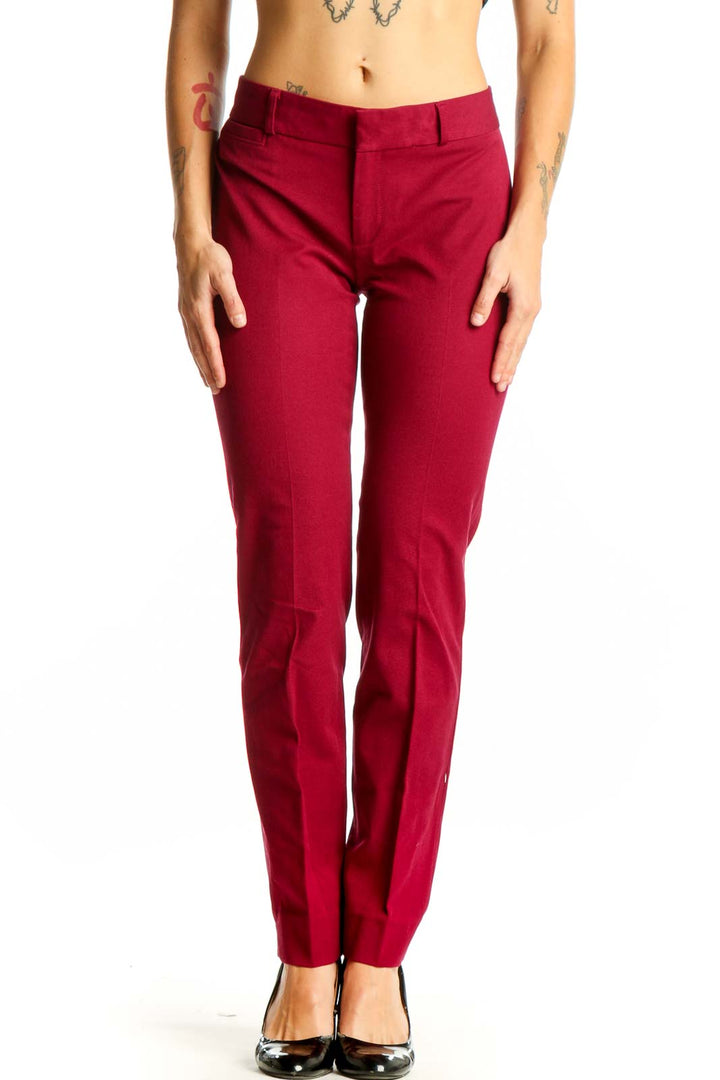 Front view of red slim-fit Banana Republic trousers on model