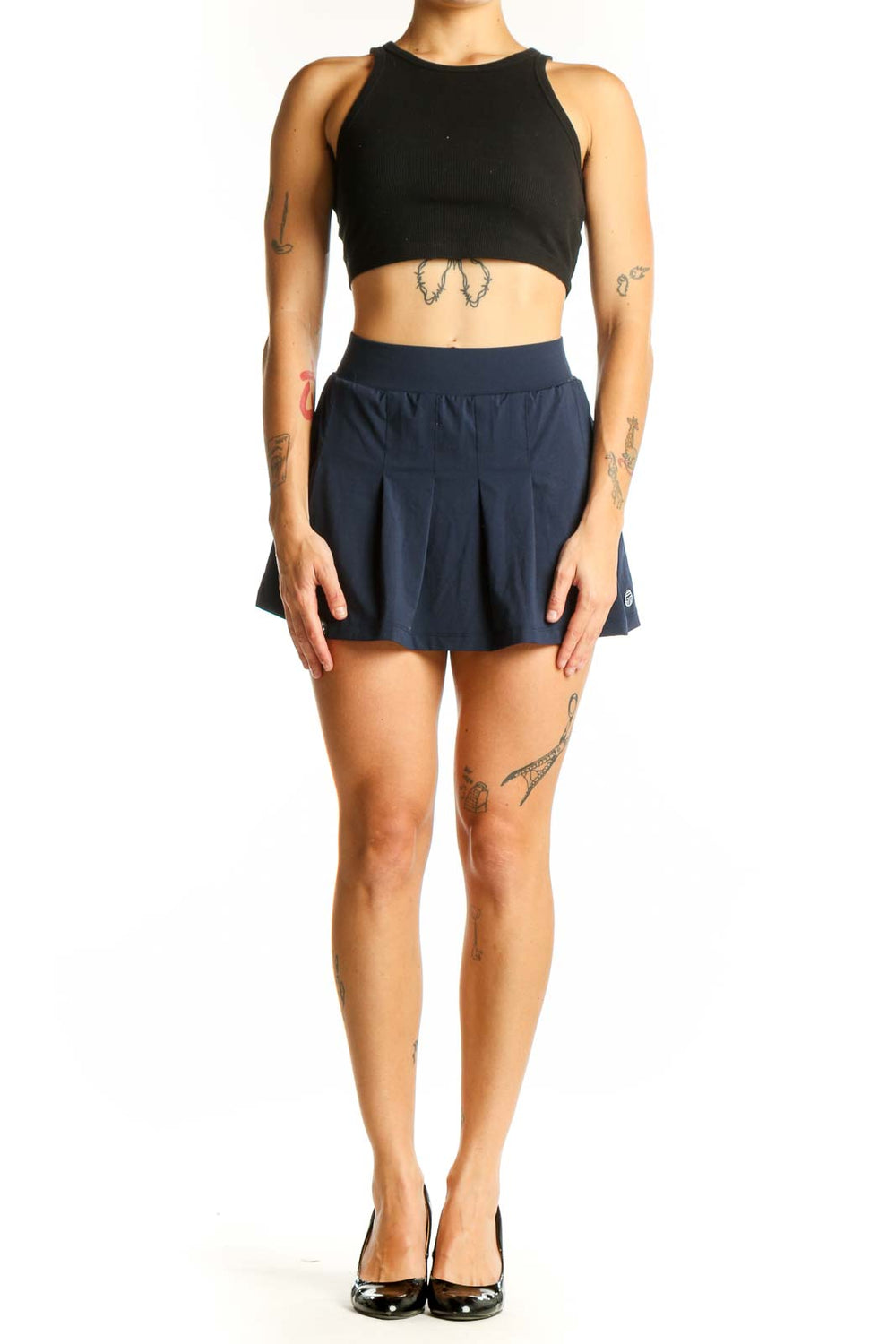 Front view of TORY SPORT navy pleated tennis skirt