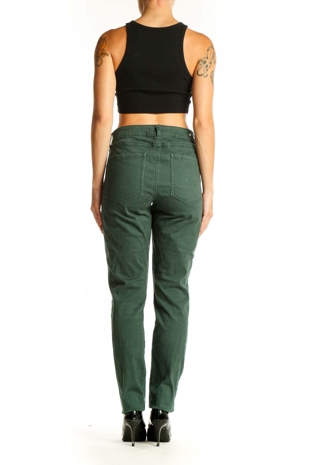 Side view of woman wearing green Cabi straight leg jeans