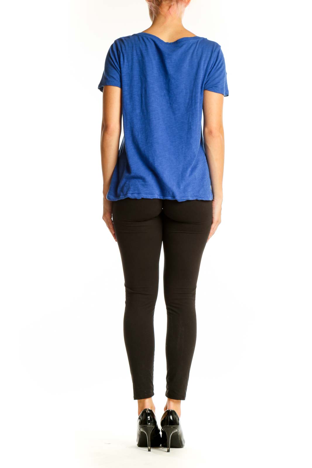 Side view of woman wearing blue J.Crew V-neck short sleeve cotton top with black pants