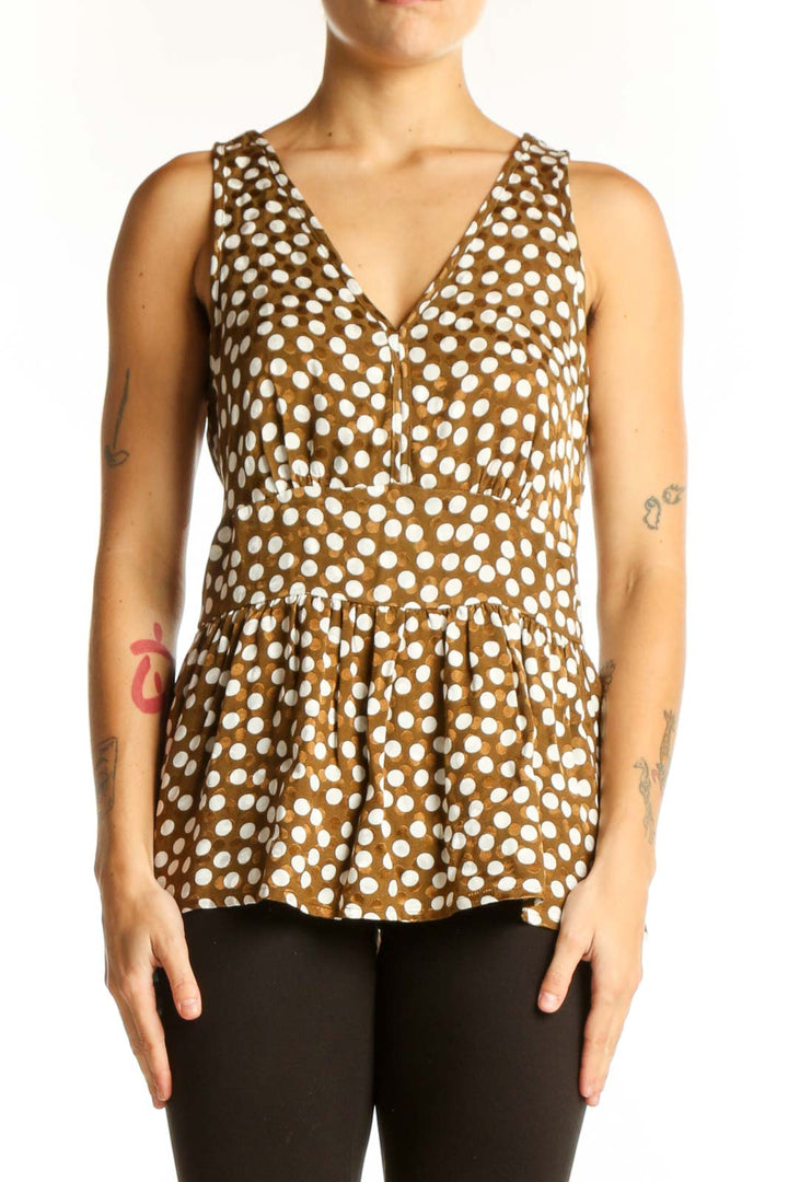 Front view of J.Crew brown polka dot peplum top with V-neckline