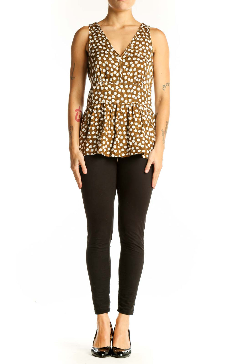 Front view of J.Crew brown polka dot peplum top with V-neckline