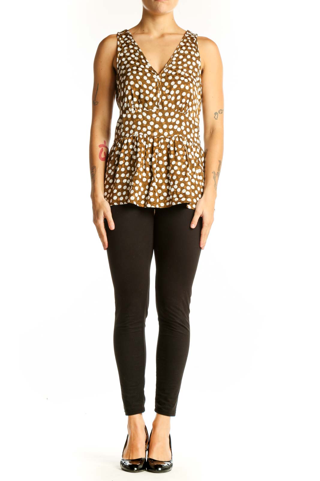 Front view of J.Crew brown polka dot peplum top with V-neckline