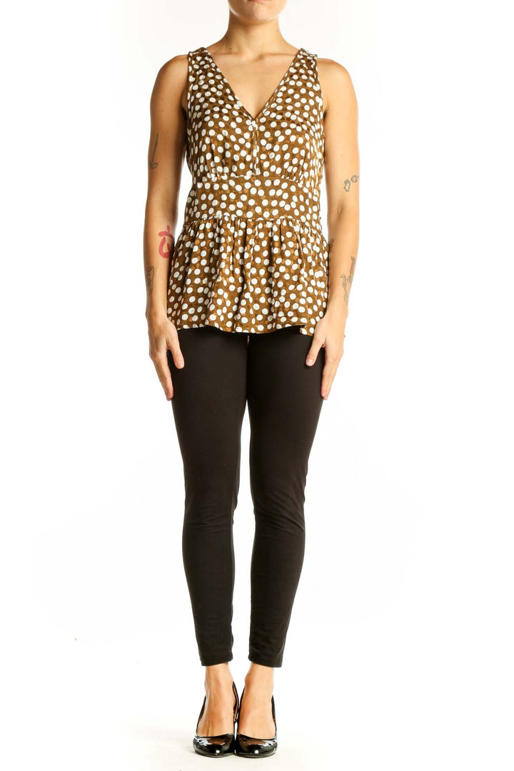 Front view of J.Crew brown polka dot peplum top with V-neckline