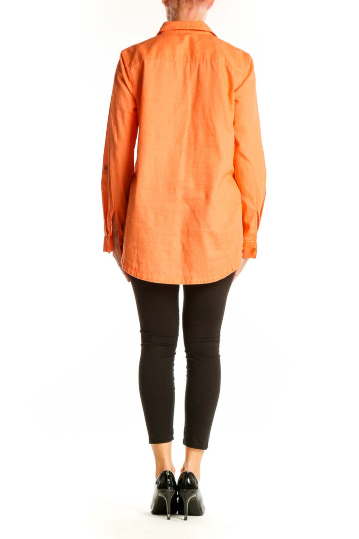 Back view of orange Eddie Bauer button-up shirt showing longer hem