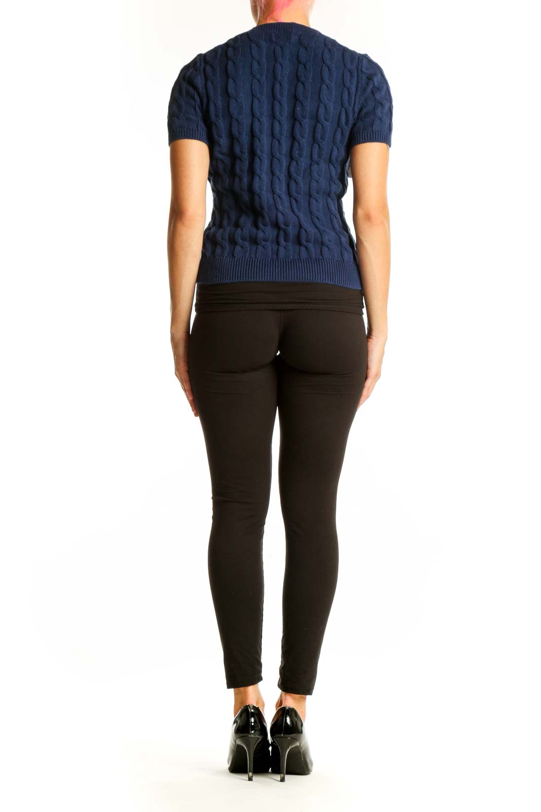 Side view of J.Crew navy cable knit short sleeve sweater on model with black pants