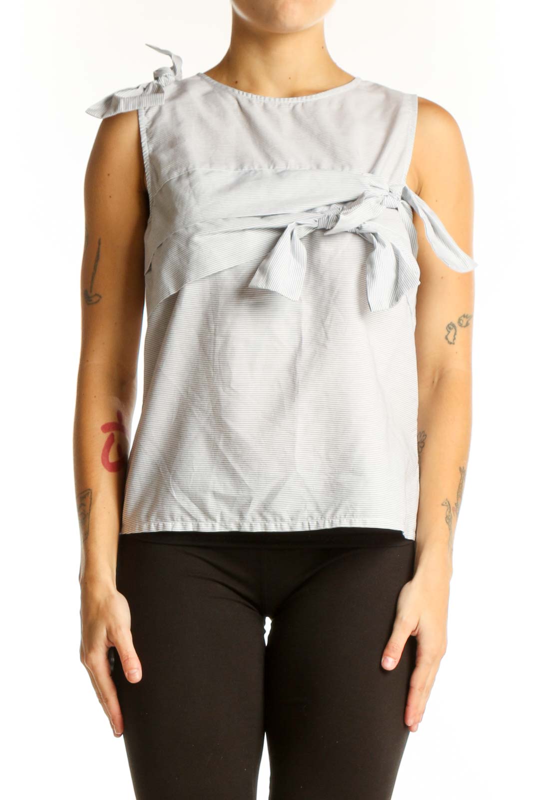 Front view of light gray sleeveless cotton top with bow details