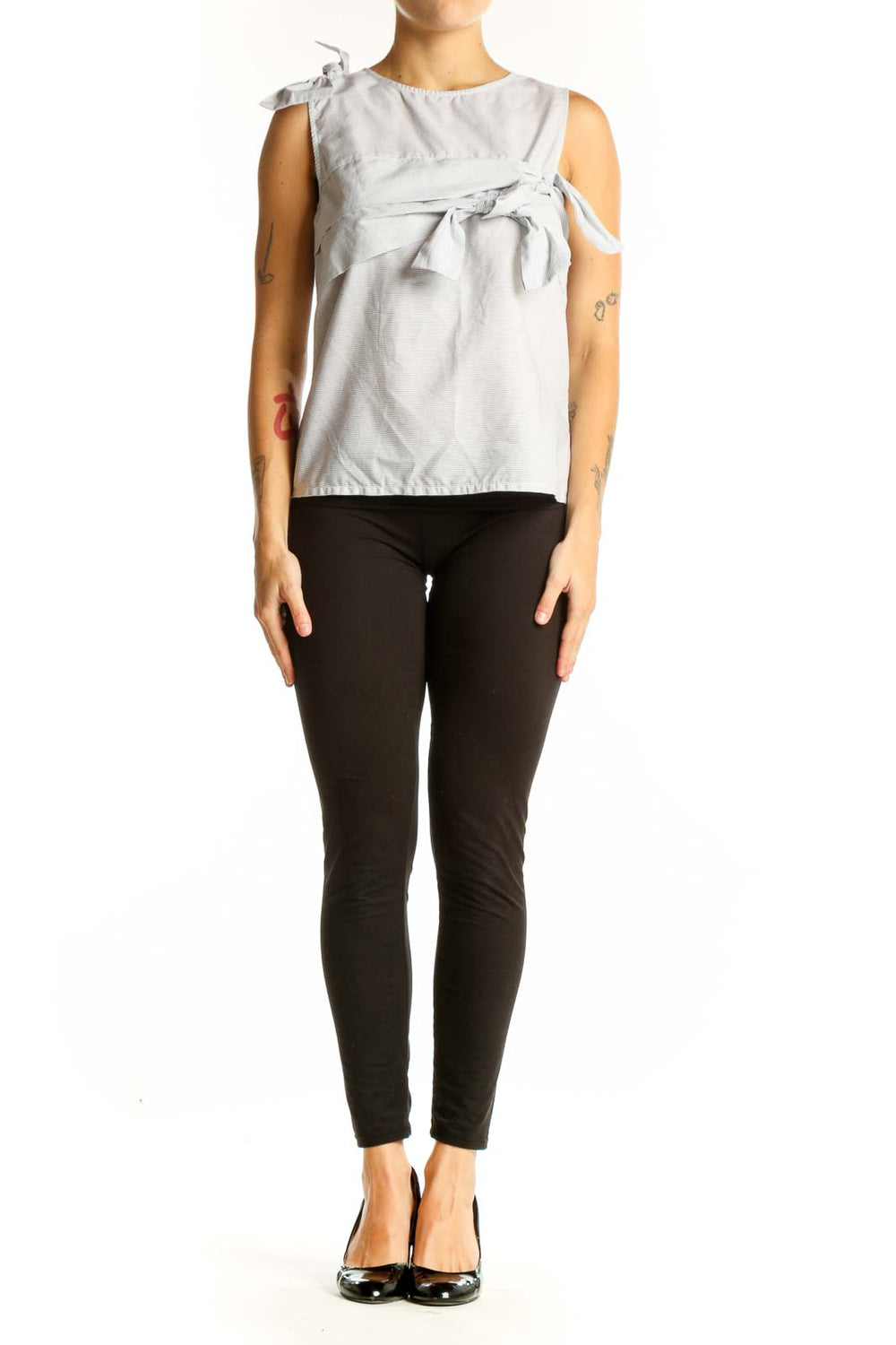 Front view of light gray sleeveless cotton top with bow details