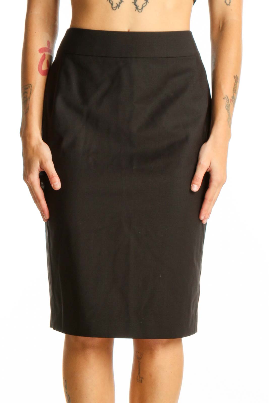 Front view of black Ann Taylor pencil skirt on model