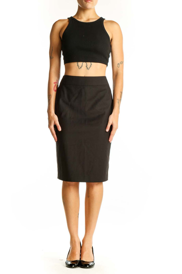 Front view of black Ann Taylor pencil skirt on model