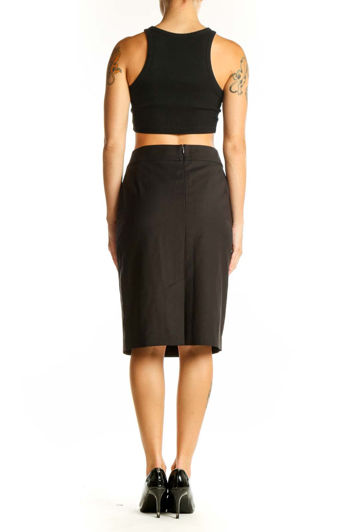 Side view of black Ann Taylor pencil skirt with crop top