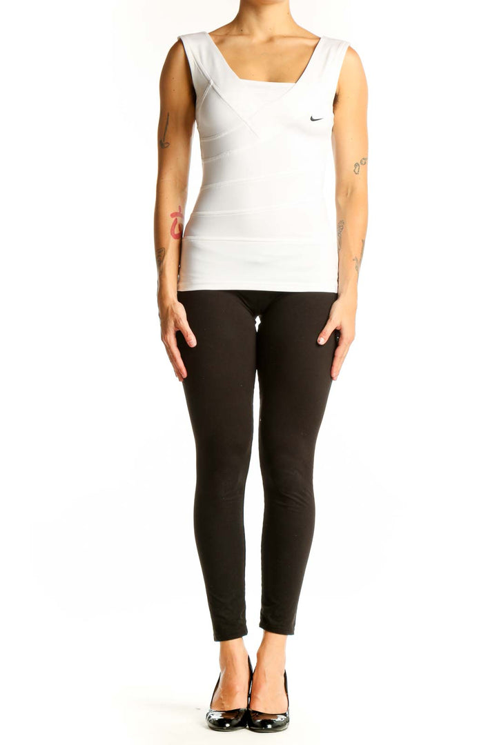 Front view of white Nike sleeveless athletic tank top with asymmetrical strap design