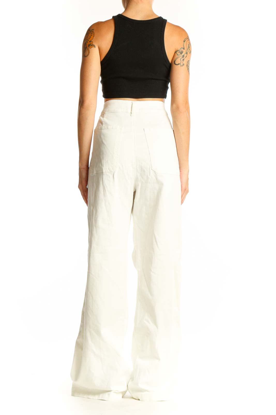 Side view of model wearing white wide-leg trousers from KUT from the Kloth