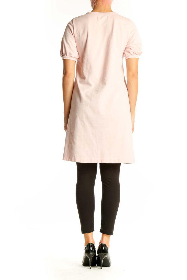 Side view of Madewell blush pink cotton t-shirt dress showing relaxed fit