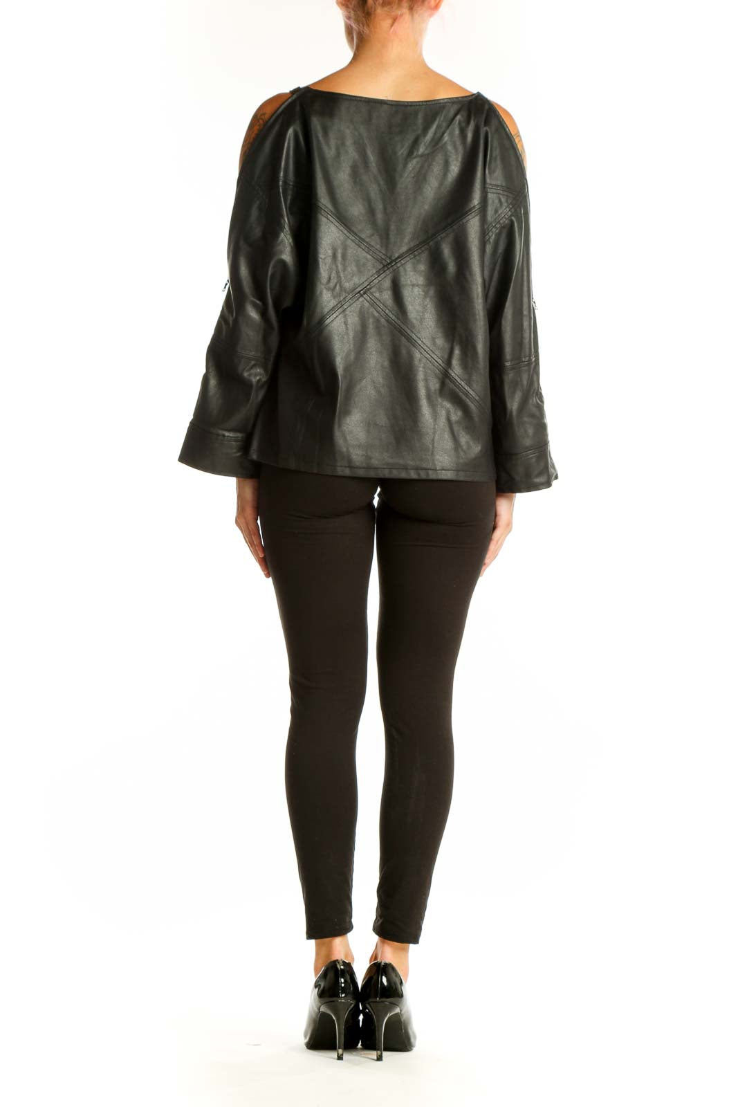 Side view of black leather cold shoulder top showing cutout design