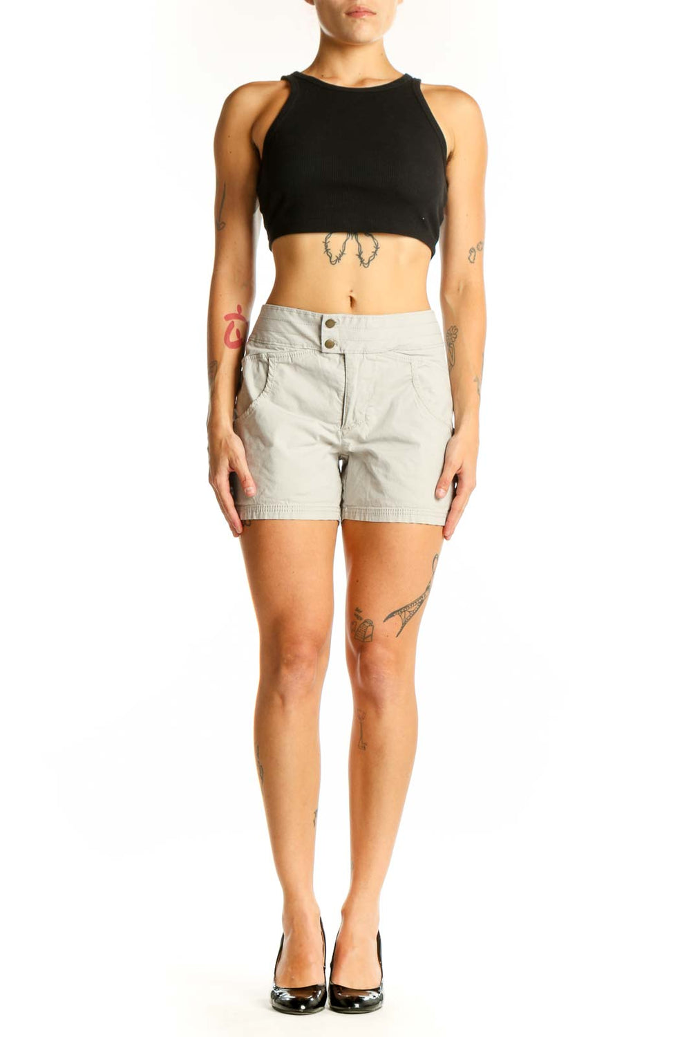 Front view of Nau beige cotton-blend shorts with double-button closure
