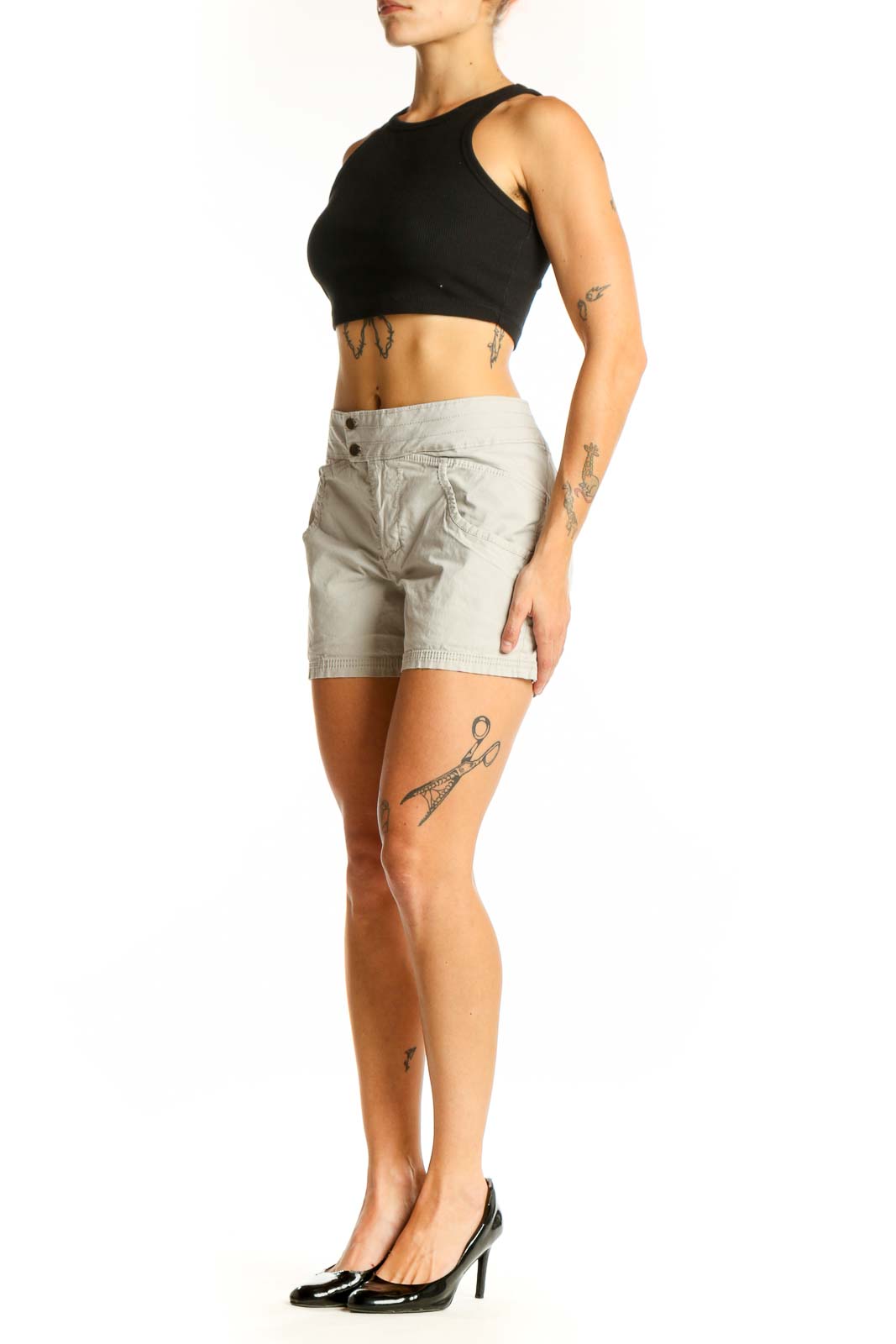 Front view of Nau beige cotton-blend shorts with double-button closure