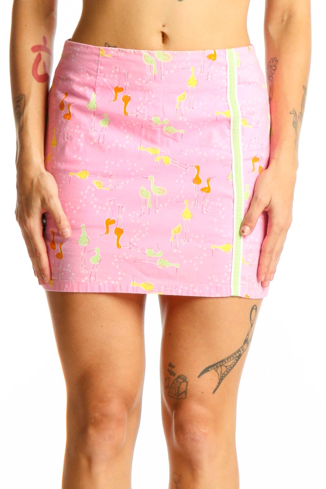 Front view of pink Lilly Pulitzer mini skirt with flamingo print and green side stripe