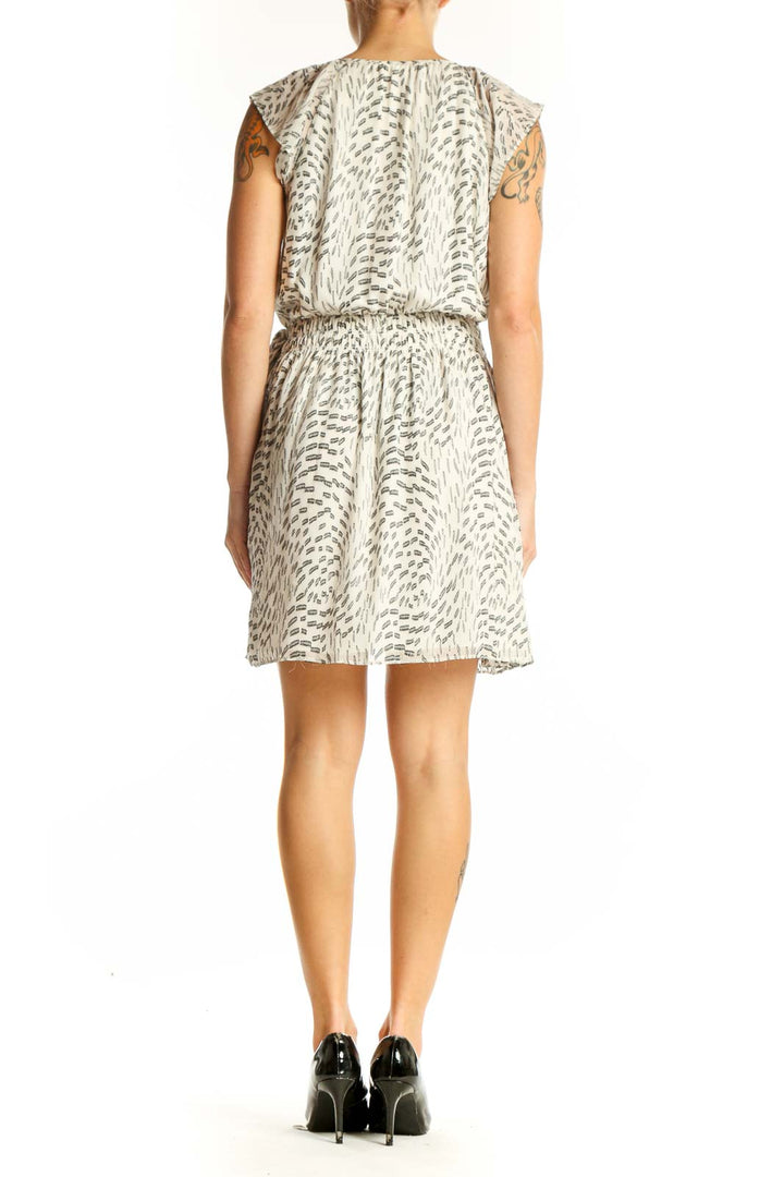 Side view of Ramy Brook beige floral print wrap dress showing adjustable waist tie