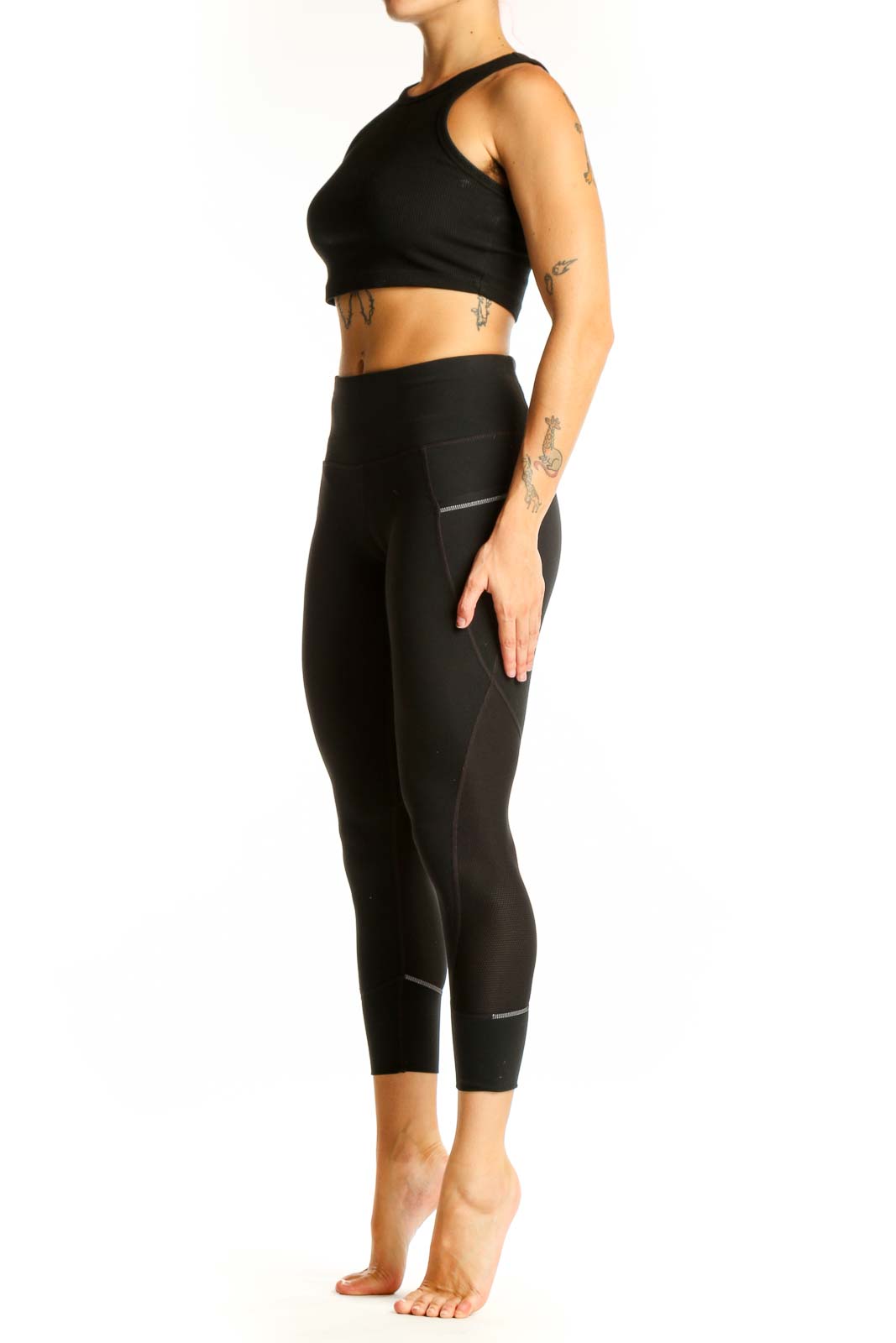 Front view of black Nike high-waisted cropped leggings with side pockets
