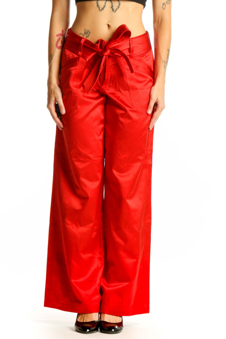 Front view of red satin wide-leg pants with bow-tie waist by Armani Exchange