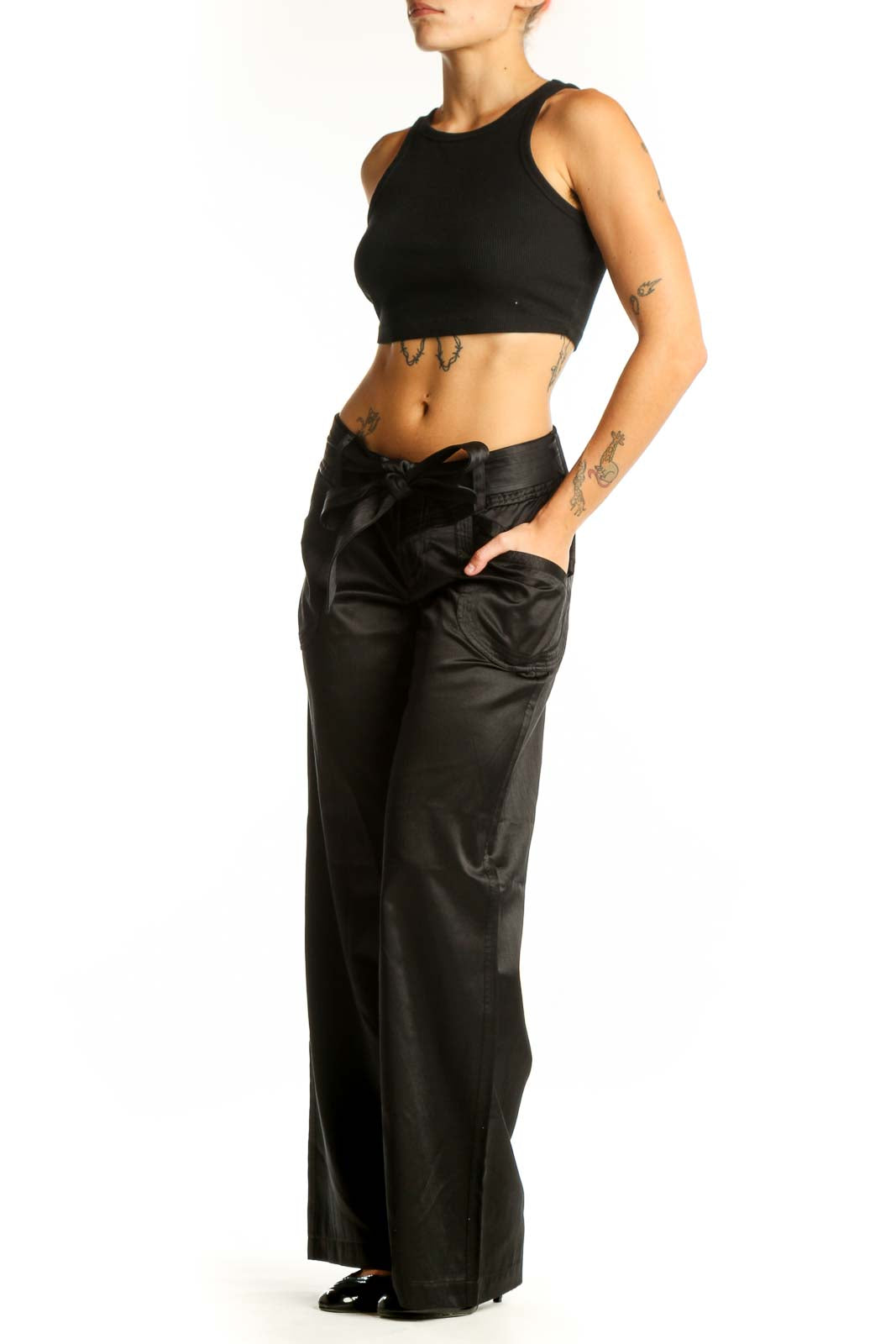 Front view of Armani Exchange black satin wide-leg dress pants with bow detail