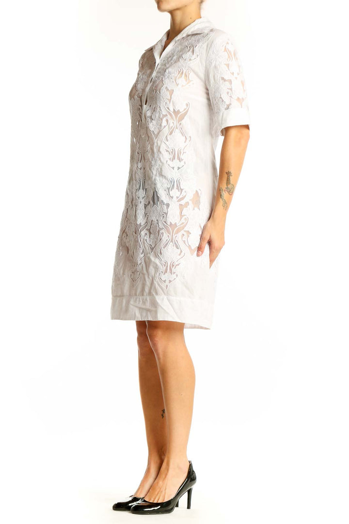 Front view of Elie Tahari white lace overlay shirt dress with button-down front