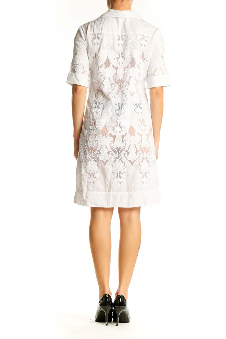 Side view of Elie Tahari white lace overlay shirt dress showing intricate lace pattern