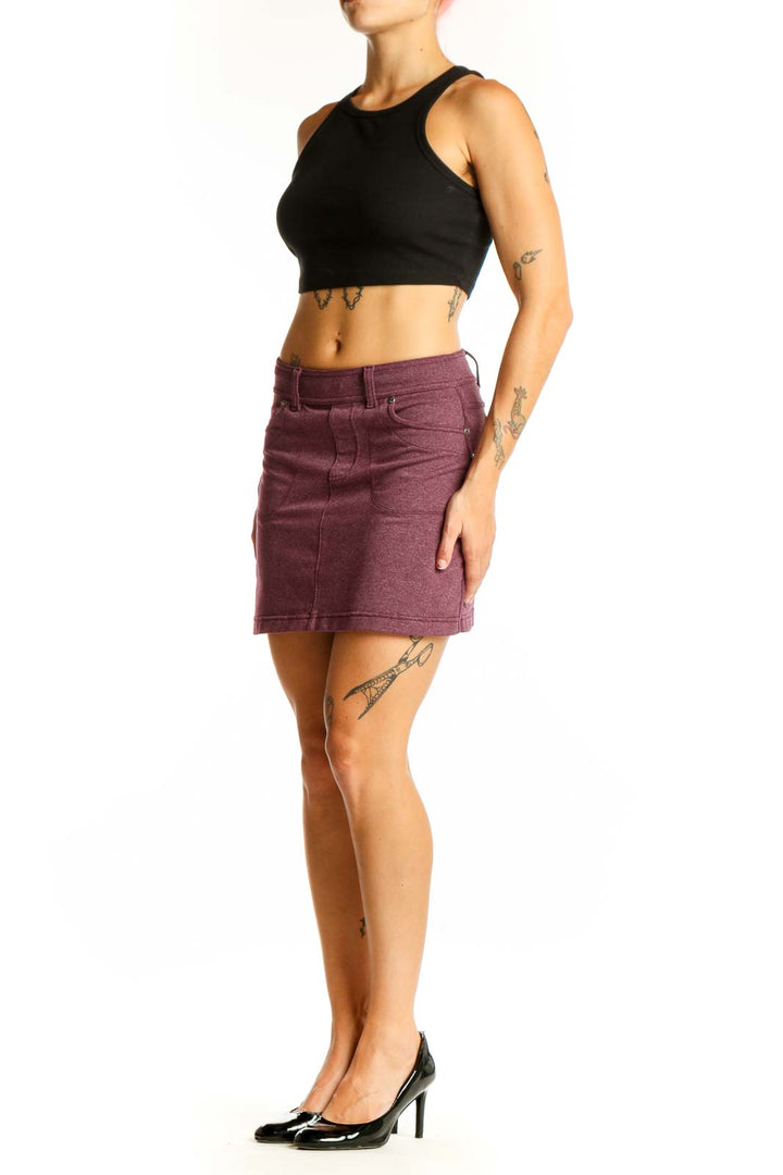 Front view of Athleta burgundy mini skirt with pockets