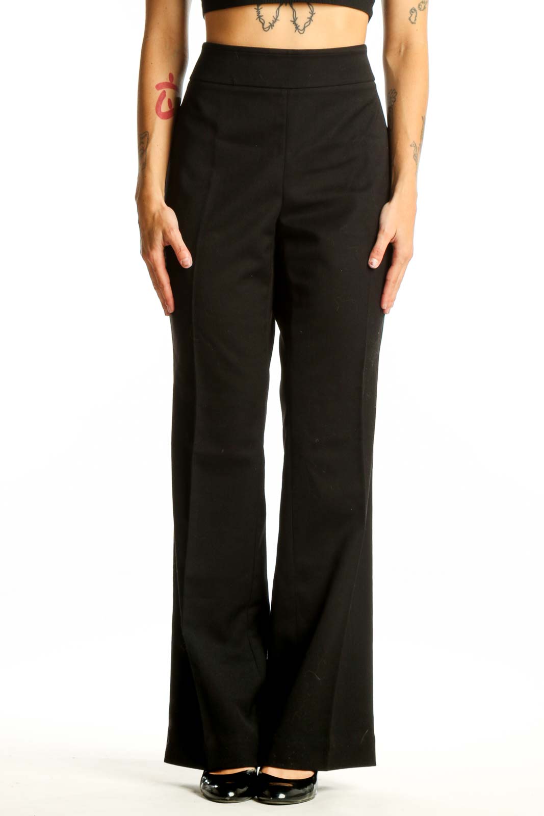 Front view of black wide-leg dress pants from White House Black Market