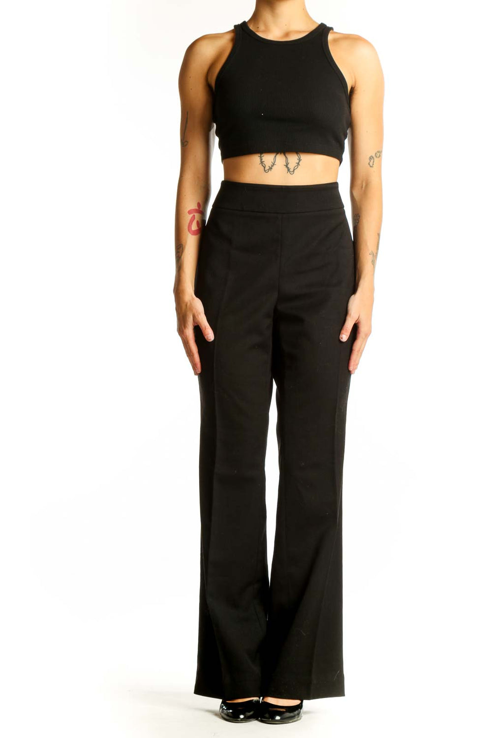 Front view of black wide-leg dress pants from White House Black Market