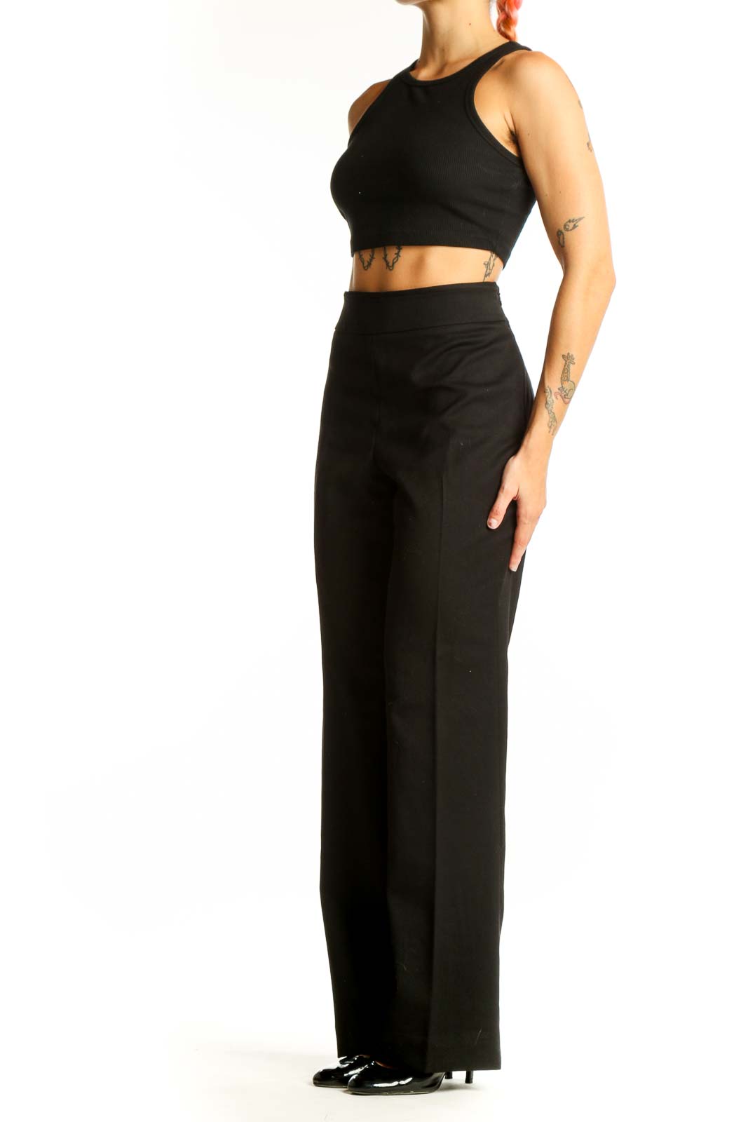 Front view of black wide-leg dress pants from White House Black Market