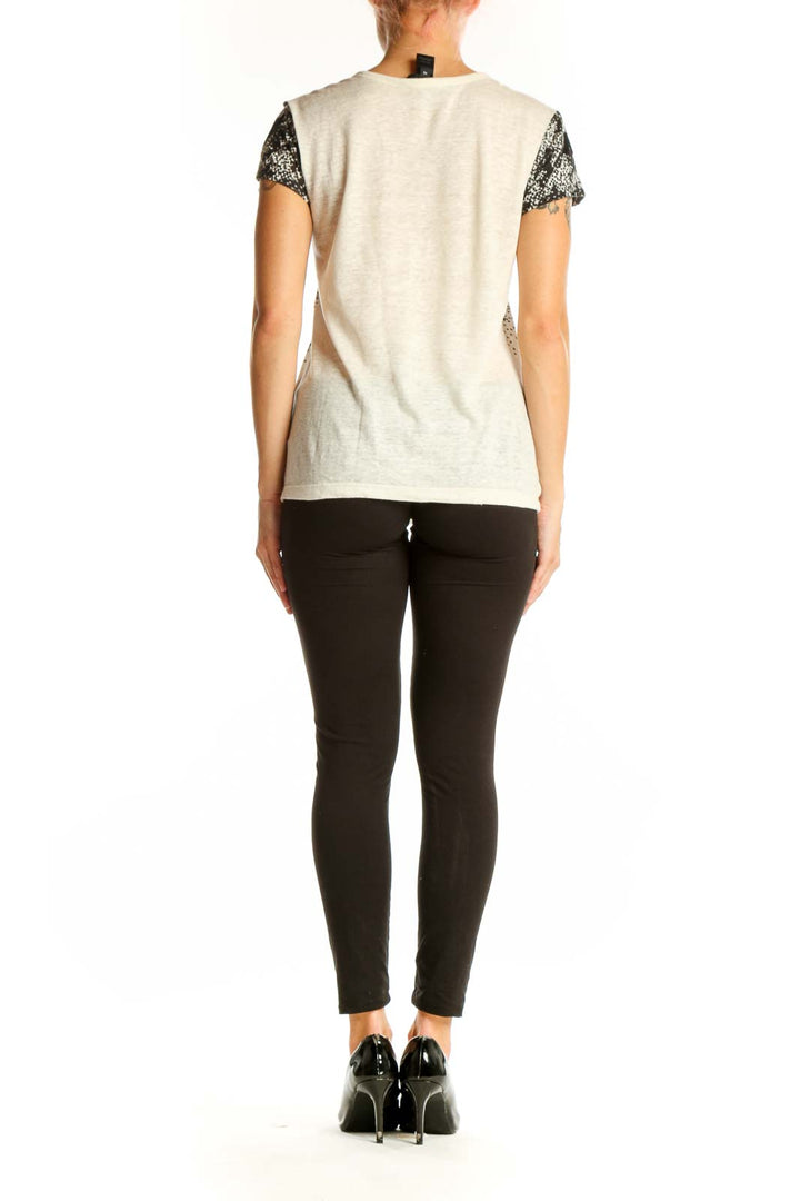Side view of Marc By Marc Jacobs white linen top showing houndstooth pattern fade