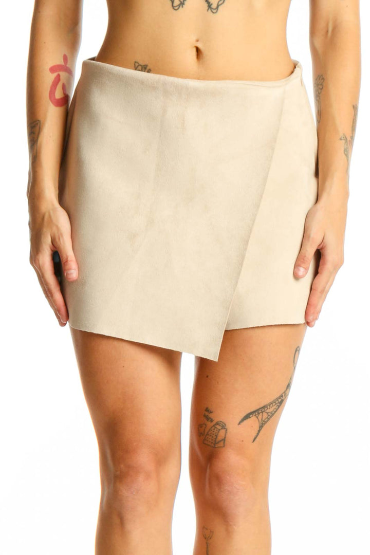 Front view of beige wrap-style mini skort from Zara