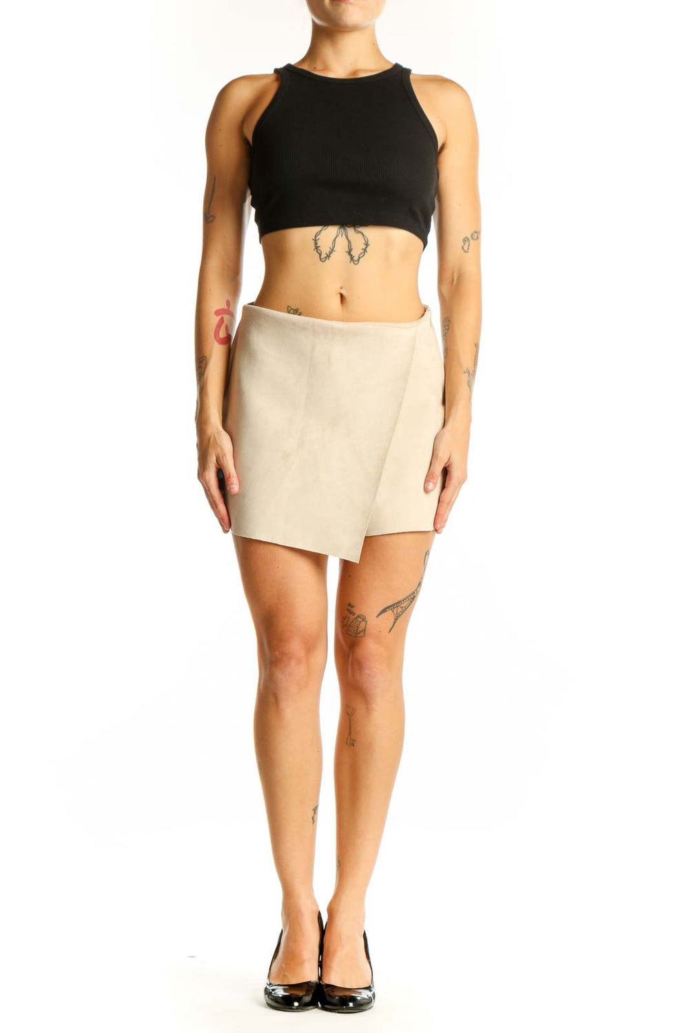 Front view of beige wrap-style mini skort from Zara