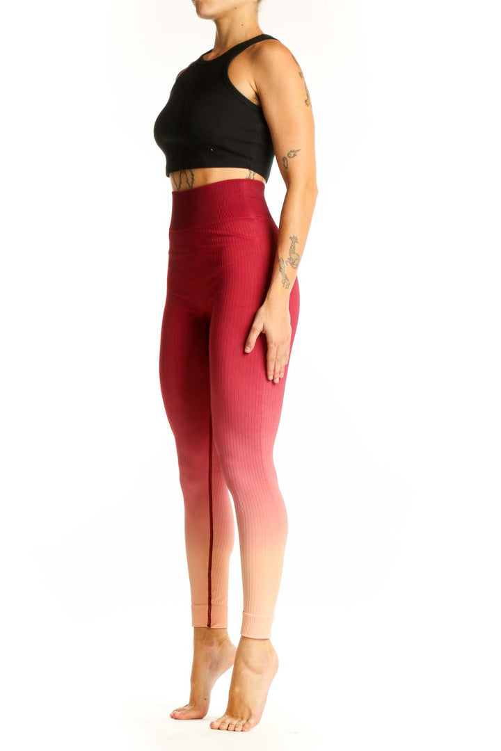 Front view of red ombre high-waisted ribbed leggings from The Upside