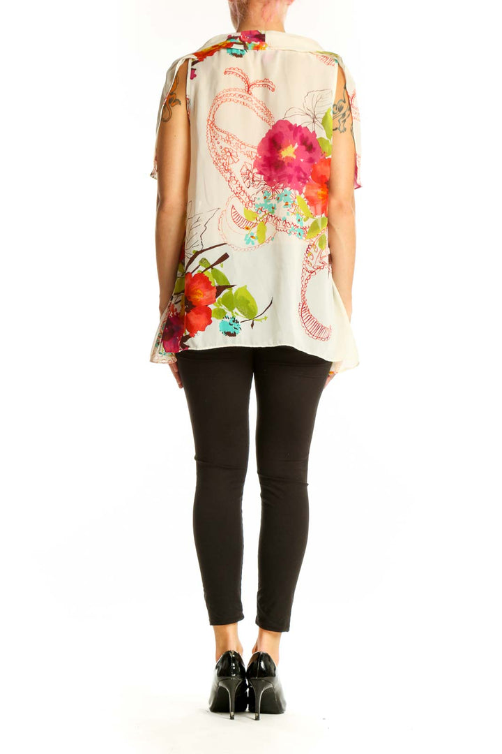 Side view of Sunny Leigh white floral print layered blouse showing asymmetrical hemline