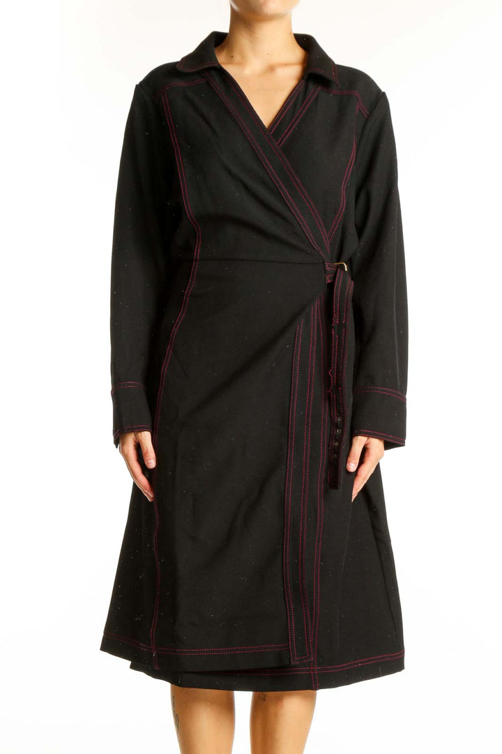 Front view of Estate black wrap dress with red contrast stitching