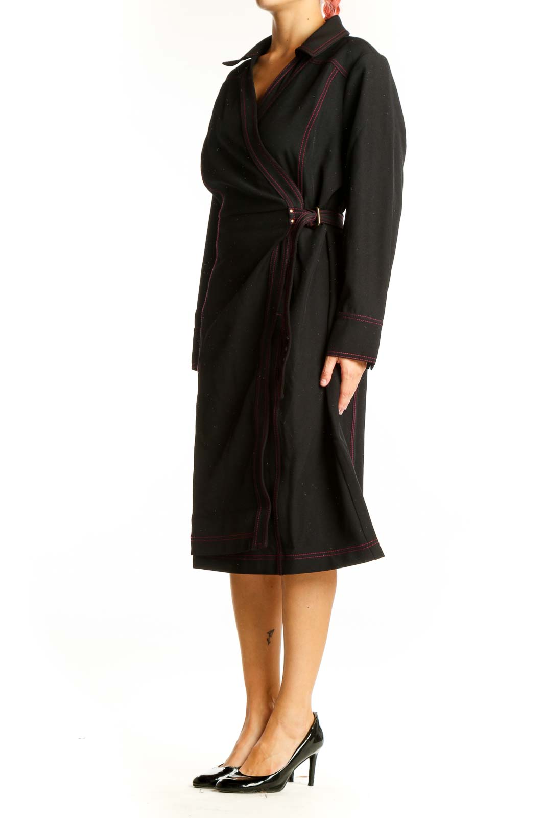 Front view of Estate black wrap dress with red contrast stitching