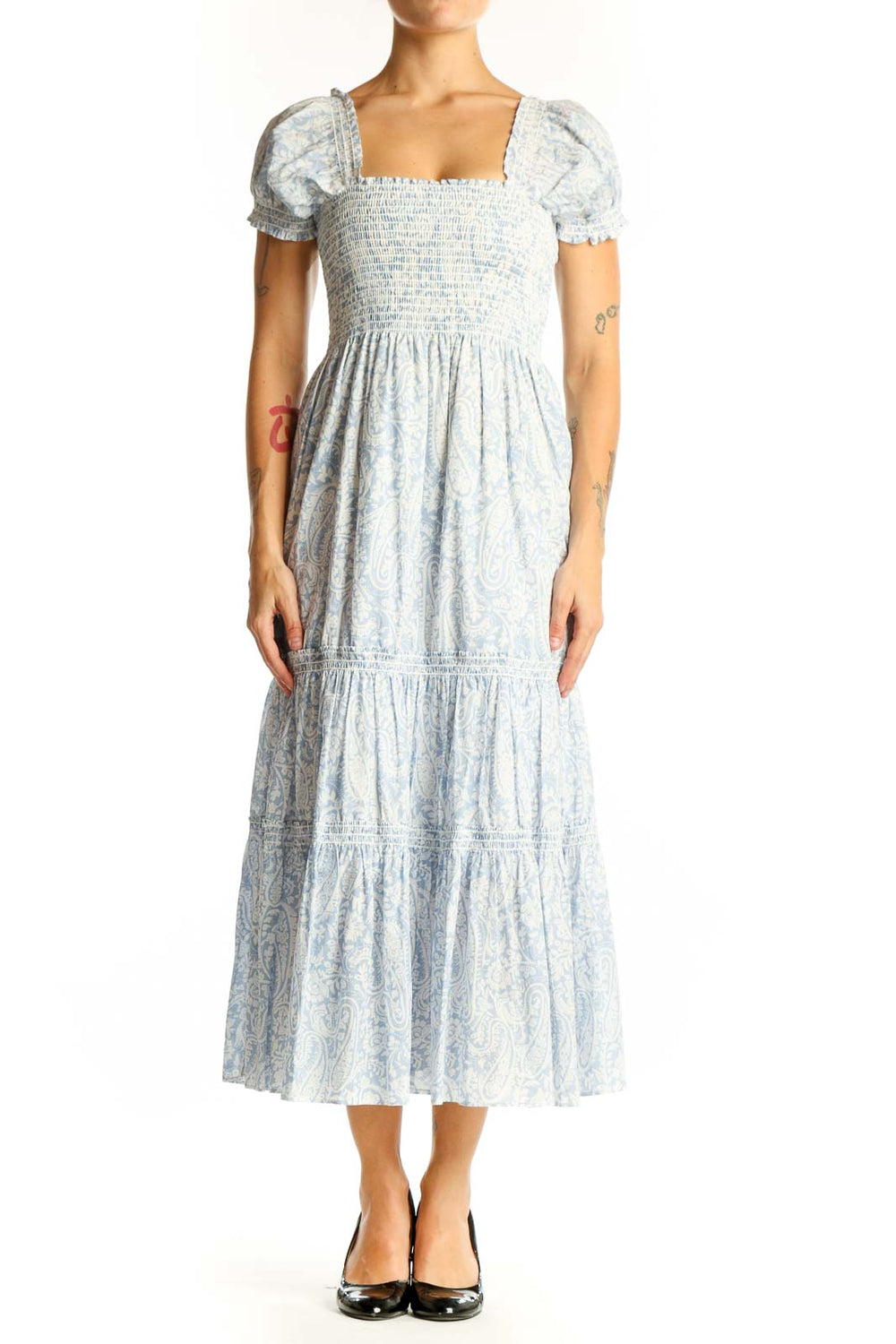 Front view of light blue floral midi dress with smocked bodice and puff sleeves