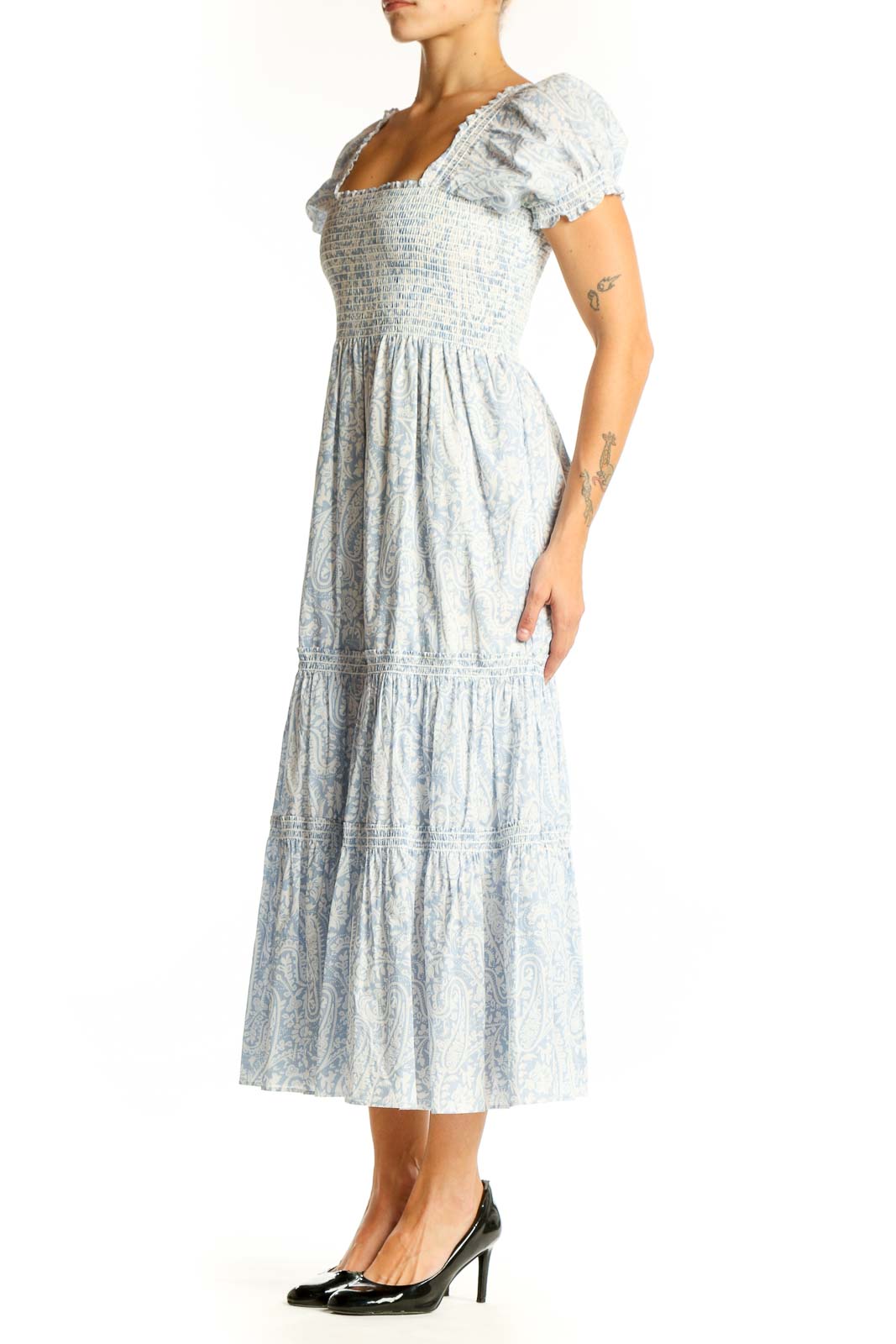Front view of light blue floral midi dress with smocked bodice and puff sleeves