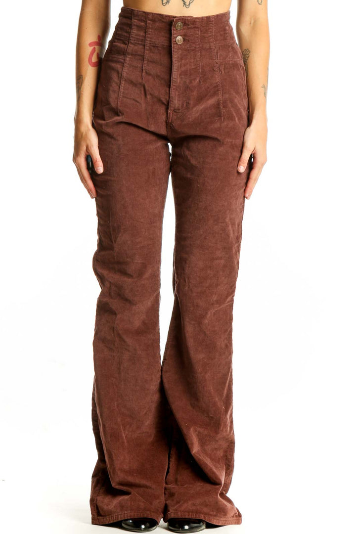 Front view of WE THE FREE brown corduroy high-waisted flared pants