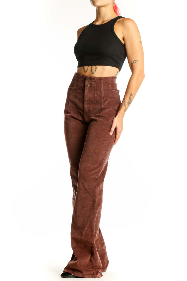 Front view of WE THE FREE brown corduroy high-waisted flared pants