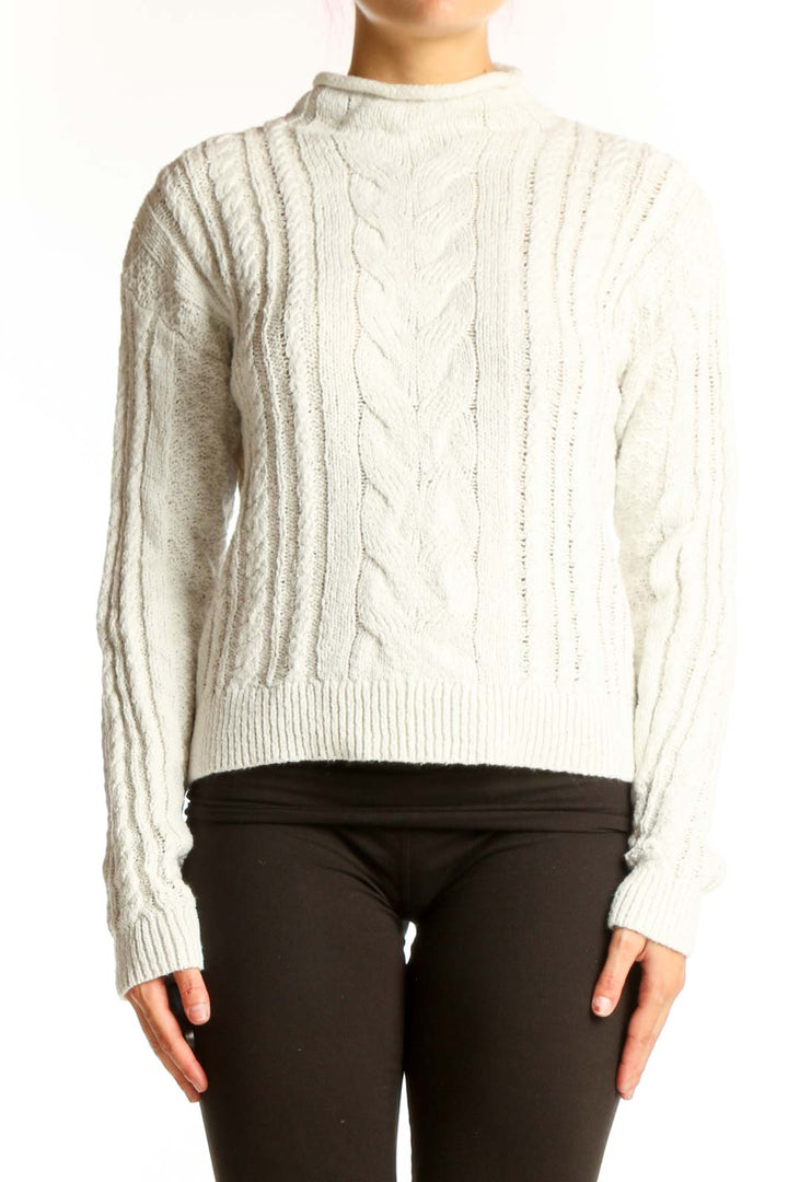 Front view of cream J.Crew cable knit mock neck sweater