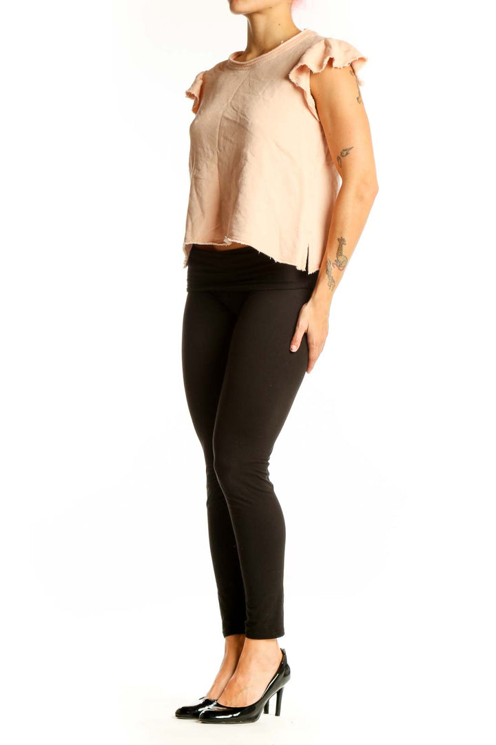 Front view of blush Joie cotton top with ruffled cap sleeves