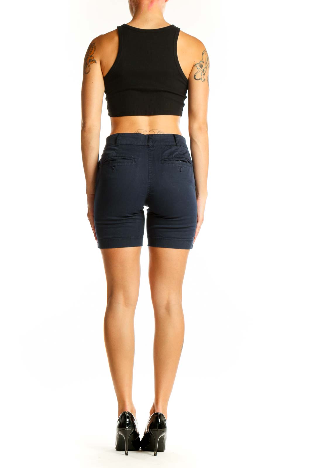 Side view of model wearing J.Crew navy cotton chino shorts with black top
