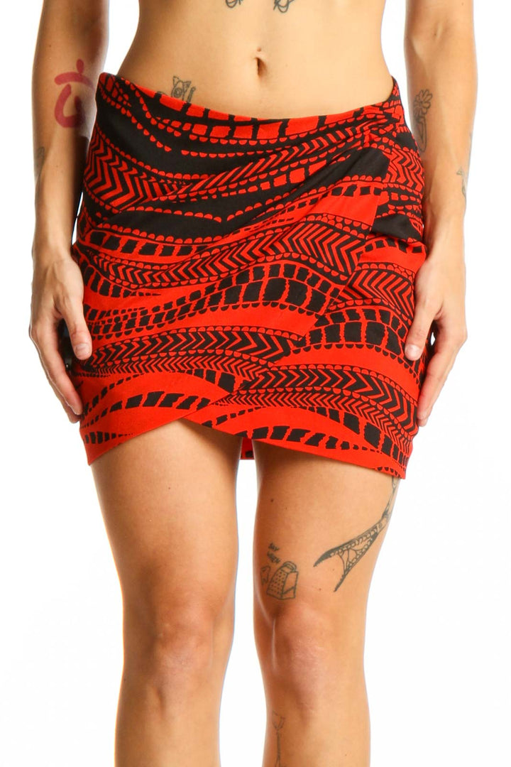 Front view of red geometric print mini skirt by Bebe