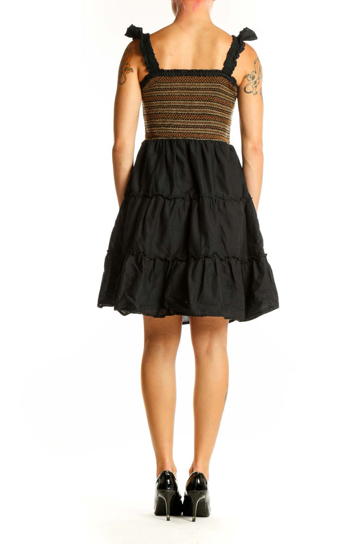 Side view of J.Crew Black and Brown Striped Cotton Sundress showing tiered skirt and tie shoulders