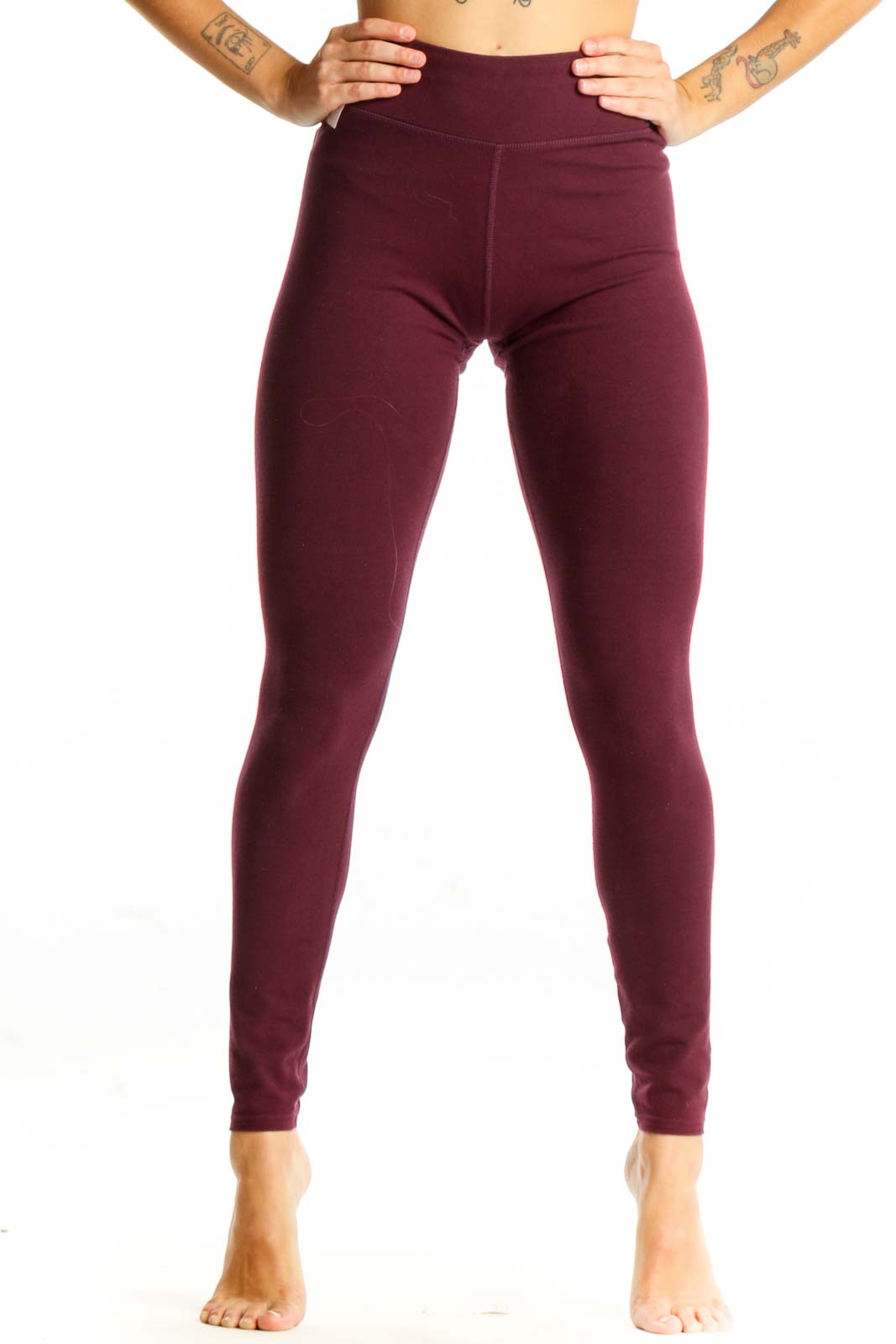 Front view of burgundy high-waisted Pact leggings on model